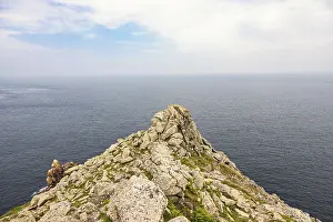 Seascape view to the horizon from a rocky peninsula at the coast