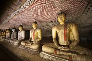 Seated Buddha statues in the Dambulla cave temple