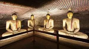 Seated Buddha statues in the Dambulla cave temple