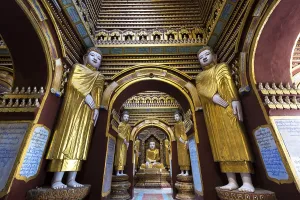 Seated and standing Buddha statues