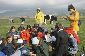 Secondary school girls doing fieldwork in geography, United Kingdom 1970s Girls doing fieldwork Observational survey on land use in the field 1977