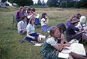 Secondary school girls doing geographical fieldwork, United Kingdom 1970s Girls doing fieldwork, observing, sketching, taking notes, using Ordnance Survey map 1975