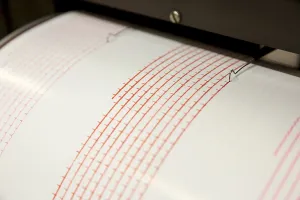 Seismograph records an earthquake on the sheet of measuring paper