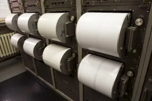 Seismograph records an earthquake on the sheet of measuring paper