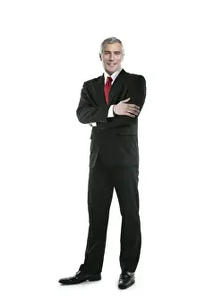 Senior businessman posing stand isolated on white