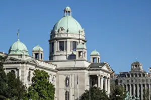 Serbian parliament building with dome and equestrian sculptures