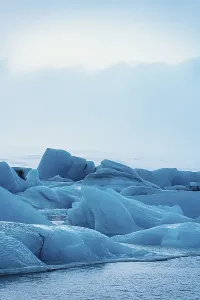 Serene icy landscape with blue glacial formations in a cold winter setting