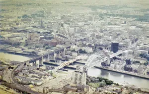 Series of oblique aerial views of sites associated with Hadrian's Wall, c. 1970s three bridges over the River Tyne, Newcastle city centre, Northumberland, England, United Kingdom from the south-east