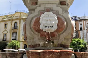Seville, Marble fountain with a lion's face from which water flows