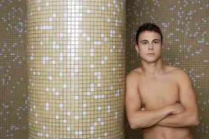 Category Historic EN Prints: Sexy man crossed arms in tiled background posing