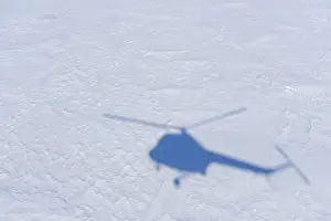 Shadow from Helicopter flight over pack ice to penguin colony