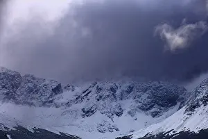 Shady mountains with snow under dark