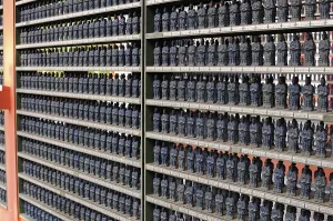 Shelf full of miniature Buddha statues