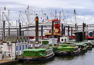 Ships, sailors and launches in Hamburg harbour at the Speicherstadt