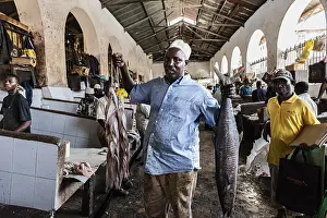 Shoppers and traders at the fish market in Darajani Market