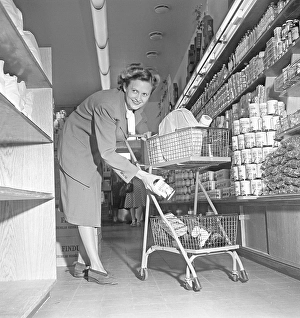 Shopping in the 1940s. A woman shops in a self service store