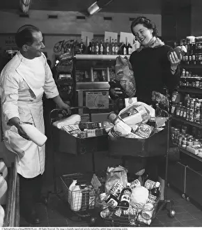 Shopping in the 1950s. A woman shops in a self service store