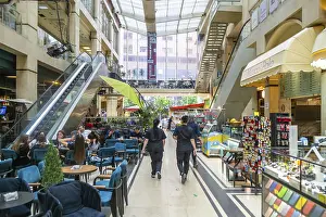 Shops and people inside shopping mall Galeria 17 Nentori in city centre