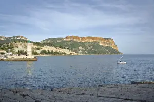 Shore with bay, boat, lighthouse and rock Soubeyran