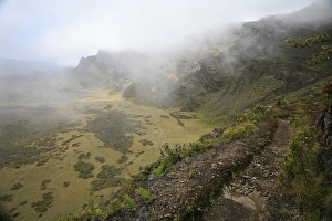 Category Mountain Landscapes Prints: Shreds of clouds racing through thermals above the crater in Haleakala National Park