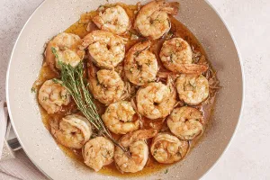 Shrimp dish cooked, in savory sauce