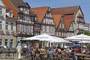 Sidewalk cafe in front of half-timbered houses