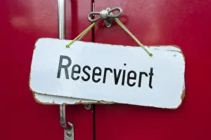 Framed Print : Sign, 'Reserviert', German for 'Reserved' in a train compartment of a historic cog railway Framed Print : Sign, 'Reserviert', German for 'Reserved' in a train compartment of a historic cog railway