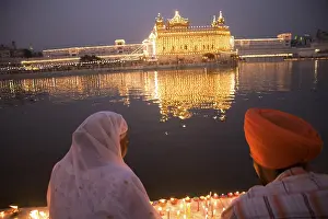Sikh couple sitting holy water