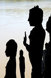 Silhouette of Buddha statues Pak Ou Cave near Luang Prabang Laos