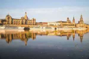 Silhouette of the Old Town with reflection in the Elbe in the morning