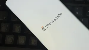 Silicon Studio logo on smartphone placed on a keyboard