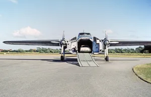 Silver City Airways air ferry, loading cars onto a Bristol Superfreighter aircraft, Ferryfield Airport, Lydd, Kent England, UK 1959
