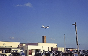 Silver City Airways ferry, Bristol Superfreighter aeroplane flying over the terminal buildings, Ferryfield Airport, Lydd, Kent England, UK 1959