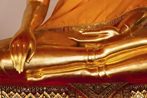 Sitting golden Buddha statue close up details