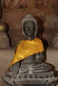 Sitting old bronze Buddha statue