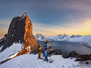October 2023 Prints: Two ski mountaineers at the Ascend of the steep mountain Segla