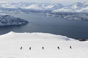 Ski touring group going downhill