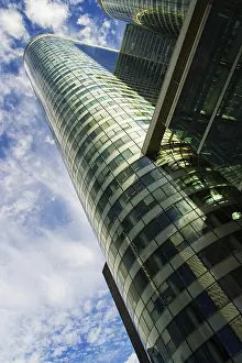 Framed Print : Skyscraper und cloudy blue sky