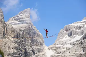 Slackliner in the mountains, mountain peaks of the Brenta Mountains