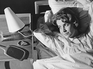 Sleep in the 1960s. A young woman lies comfortably ensconced in a bed