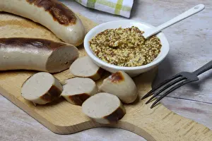Sliced bratwurst and skin with Dijon mustard