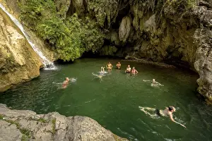 Small bathing lake in the Valle de los Ingenios with tourists
