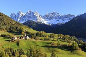 A small church in the midst of an autumnal mountain landscape in South Tyrol