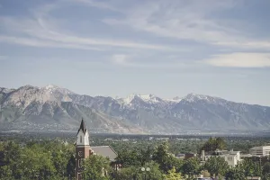 Small city church in a valley near mountains