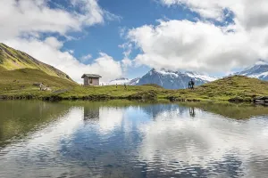 Small house at Bachalpsee, behind the Wetterhorn and Schreckhorn