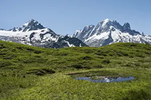 Small mountain lake at Aiguillette de Poisettes
