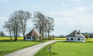 Two small round houses by a road in Ingelstorp in Ystad municipality