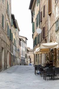 Small shopping street in the historic centre of Siena
