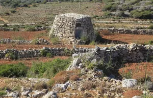 Small stone farm building in fields near Mellieha Bay