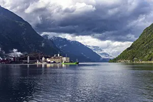 Small town of Odda. Magnificent Hardanger fjord between forested mountains